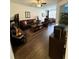 Spacious living room with hardwood floors, ample seating, and plenty of natural light at 1302 Speckle Park Way, Stockbridge, GA 30281