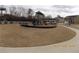 Community playground featuring slides, structures, and a safe playing surface in a residential setting at 1302 Speckle Park Way, Stockbridge, GA 30281
