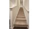Carpeted stairway with white banister leading to the upper level at 1302 Speckle Park Way, Stockbridge, GA 30281