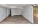 A finished basement has wood-look floors and a sliding glass door to the outdoors at 1507 Fair Haven Dr, Riverdale, GA 30296