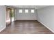 Basement area with wood-look flooring and sliding glass door at 1507 Fair Haven Dr, Riverdale, GA 30296