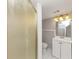 Bathroom with shower and vanity with updated lighting at 1507 Fair Haven Dr, Riverdale, GA 30296