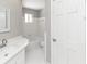 Bright bathroom featuring a tub and shower combination and modern fixtures at 1507 Fair Haven Dr, Riverdale, GA 30296
