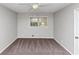 Carpeted bedroom featuring a window and a ceiling fan at 1507 Fair Haven Dr, Riverdale, GA 30296
