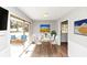 Cozy dining area with a slider to a patio, hardwood floors, and neutral walls at 1507 Fair Haven Dr, Riverdale, GA 30296