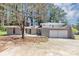 Charming single-story home features a two-car garage and gray brick exterior at 1507 Fair Haven Dr, Riverdale, GA 30296