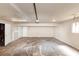 Large garage space with high ceilings and ample room for storage and hobbies at 1507 Fair Haven Dr, Riverdale, GA 30296
