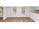 Neutral-toned living room with stylish flooring and ample natural light at 1507 Fair Haven Dr, Riverdale, GA 30296
