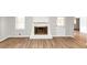 Living room features a fireplace with a white painted brick surround at 1507 Fair Haven Dr, Riverdale, GA 30296