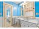 Bathroom featuring a vanity, tiled walls, and a window with vintage accents at 2265 E Lake Ne Rd, Atlanta, GA 30307