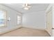 Bright bedroom featuring neutral carpet, ceiling fan, and natural light from the windows at 2265 E Lake Ne Rd, Atlanta, GA 30307