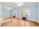 Bright bedroom with hardwood floors, mirrored closet, and large windows at 2265 E Lake Ne Rd, Atlanta, GA 30307