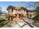 Two-story exterior with brick and siding, covered patio, and driveway at 2265 E Lake Ne Rd, Atlanta, GA 30307