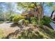 Beautiful home with a well-maintained lawn and mature trees at 2265 E Lake Ne Rd, Atlanta, GA 30307