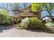 Charming two-story brick home featuring a covered porch and beautifully landscaped yard at 2265 E Lake Ne Rd, Atlanta, GA 30307