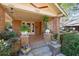 Charming covered front porch with steps, planters, and potted plants at 2265 E Lake Ne Rd, Atlanta, GA 30307