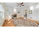 Open living room with built-in cabinets, fireplace, and hardwood floors at 2265 E Lake Ne Rd, Atlanta, GA 30307