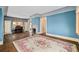 Spacious living room with hardwood floors and a classic piano at 2265 E Lake Ne Rd, Atlanta, GA 30307