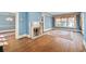 Bright living room featuring a fireplace, hardwood floors, and large windows at 2265 E Lake Ne Rd, Atlanta, GA 30307