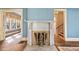 Close-up of a marble fireplace with gold trim and hardwood floors in the living room at 2265 E Lake Ne Rd, Atlanta, GA 30307