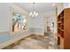 Bright home office with built-in shelves, stone floors, and a large window at 2265 E Lake Ne Rd, Atlanta, GA 30307