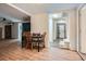 Living area featuring hardwood floors, a dining table, and access to other rooms and a washer and dryer at 2836 Waters Sw Rd, Atlanta, GA 30354