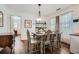 Cozy dining room featuring hardwood floors and a charming light fixture above the dining table at 2836 Waters Sw Rd, Atlanta, GA 30354