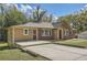 Lovely home with brick and siding, featuring a spacious front yard and ample parking at 2836 Waters Sw Rd, Atlanta, GA 30354