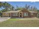 Charming brick home featuring a covered porch, well-manicured lawn, and a convenient driveway at 2836 Waters Sw Rd, Atlanta, GA 30354