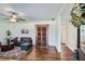 Inviting living room with hardwood floors, decorative cabinet, and bright, airy atmosphere at 2836 Waters Sw Rd, Atlanta, GA 30354