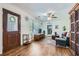 Bright living room boasting hardwood floors, and large windows that let in plenty of natural light at 2836 Waters Sw Rd, Atlanta, GA 30354