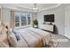 Staged bedroom featuring a ceiling fan and large windows at 3905 Delfaire Trce, Cumming, GA 30040