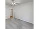 Bedroom with neutral carpeting featuring two doors and ceiling fan at 3905 Delfaire Trce, Cumming, GA 30040