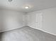 Neutral bedroom with plush carpet and ample closet space at 3905 Delfaire Trce, Cumming, GA 30040