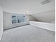 Open, carpeted bonus room with large windows providing lots of natural light at 3905 Delfaire Trce, Cumming, GA 30040