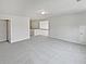 Large bonus room with neutral colors, plush carpeting, and an open layout at 3905 Delfaire Trce, Cumming, GA 30040