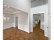 Bright dining room featuring decorative wainscoting, chandelier, wood floors and open entry ways at 3905 Delfaire Trce, Cumming, GA 30040