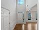 Foyer with hardwood floors, high ceilings, and ample natural light at 3905 Delfaire Trce, Cumming, GA 30040