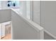 Upper hallway with views to the floors below at 3905 Delfaire Trce, Cumming, GA 30040