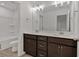 Modern bathroom with a double vanity and tub at 372 Waterbluff Dr, Mableton, GA 30126