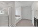 Bright bathroom featuring a glass shower and soaking tub at 372 Waterbluff Dr, Mableton, GA 30126