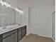 Bright bathroom with dual sinks, a soaking tub and walk-in shower at 372 Waterbluff Dr, Mableton, GA 30126