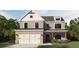 Charming two-story home with brick facade, symmetrical design, and manicured landscaping at 372 Waterbluff Dr, Mableton, GA 30126