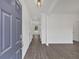 Bright foyer featuring wood-look flooring and white walls, offering a glimpse into the home's modern design at 372 Waterbluff Dr, Mableton, GA 30126