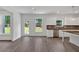 Open-concept kitchen and dining area with backyard access and modern appliances at 372 Waterbluff Dr, Mableton, GA 30126