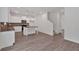 Open-concept kitchen features modern island, white cabinets, and stainless steel appliances at 372 Waterbluff Dr, Mableton, GA 30126
