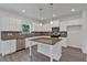 Stylish kitchen featuring white cabinets, stainless steel appliances, and a center island, perfect for cooking at 372 Waterbluff Dr, Mableton, GA 30126