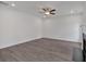 Spacious living room with gray-toned hardwood flooring and ceiling fan at 372 Waterbluff Dr, Mableton, GA 30126