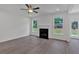 Open living room with a fireplace, hardwood flooring, and natural light at 372 Waterbluff Dr, Mableton, GA 30126