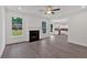 Spacious living room featuring a fireplace and view of the kitchen at 372 Waterbluff Dr, Mableton, GA 30126